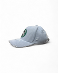 Light blue distressed baseball cap with a logo on a white background