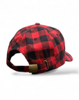 Red and black checkered baseball cap with a gold buckle on a white background