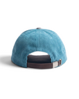 THE SEA HORSE teal corduroy baseball cap with a grey top button and brown faux-leather adjustable back strap