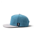THE SEA HORSE teal corduroy baseball cap with a grey brim and a seahorse logo patch on the side