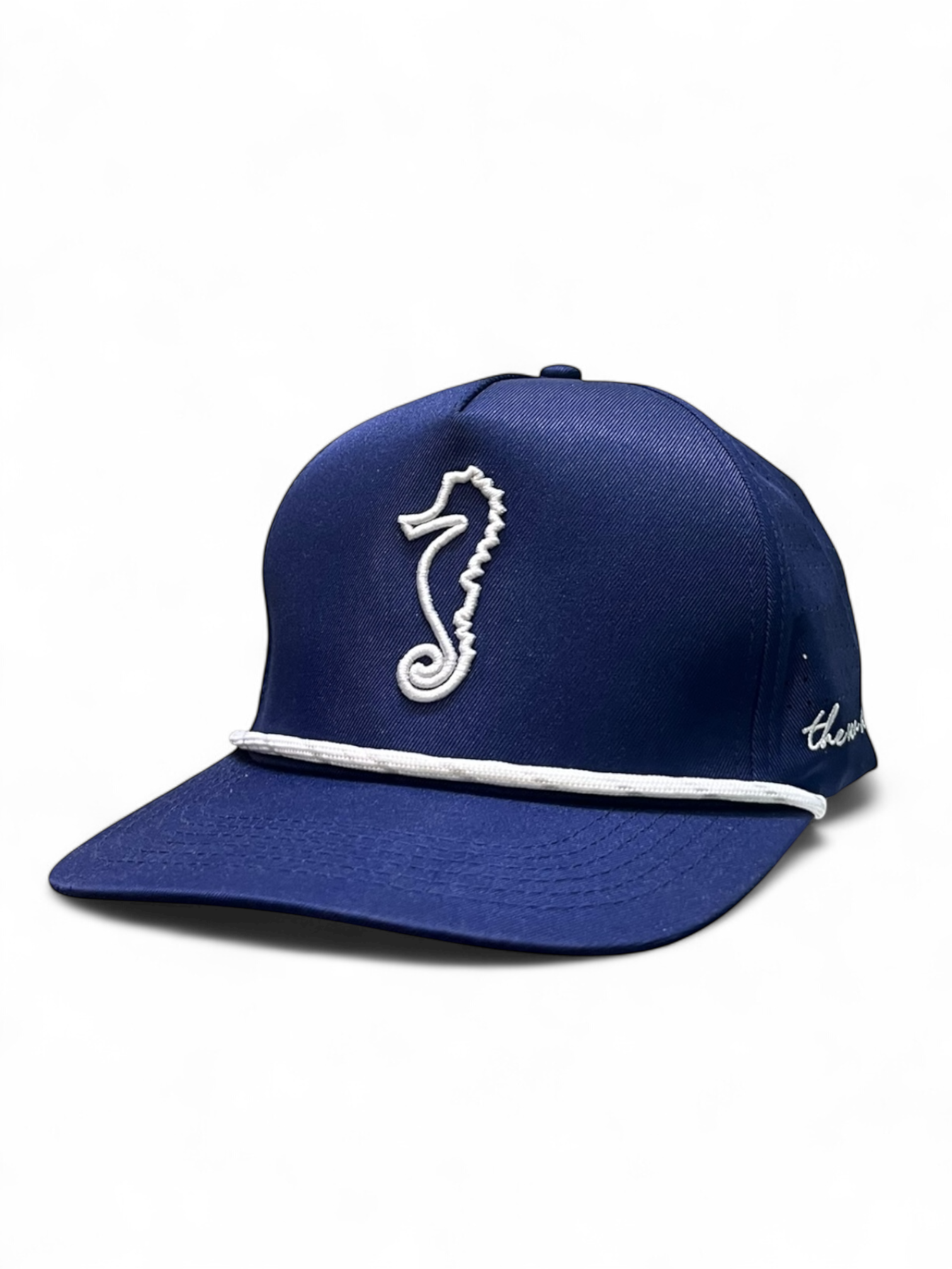Navy blue cap with a white seahorse emblem on a white background