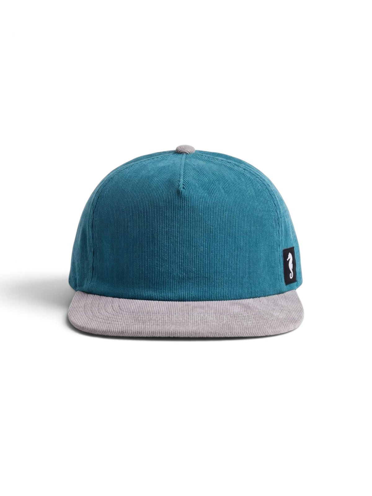 THE SEA HORSE teal corduroy baseball cap with a grey brim and a seahorse logo patch on the side.